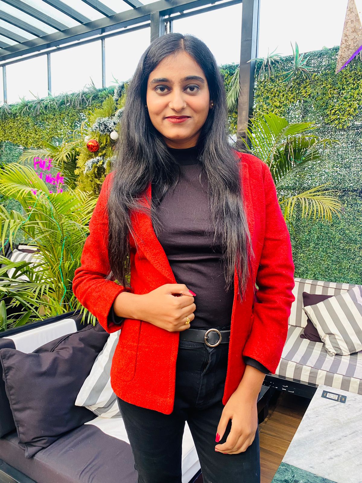 Khushboo Choudhary smiling in a white shirt